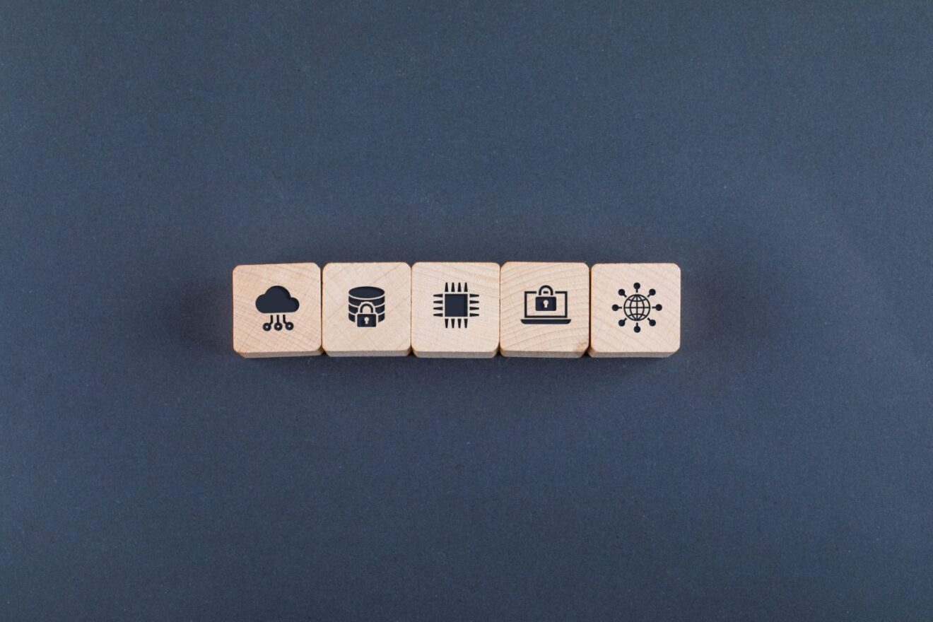 Conceptual of cloud server and business. with wooden blocks with icons on dark color background flat lay. space for text horizontal image